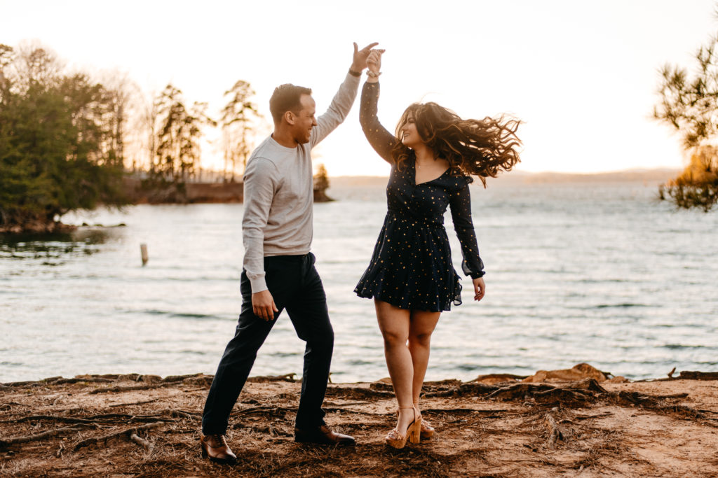 Couple dancing at Lake Lanier for their engagement session with Mary Lee Palmer Photography